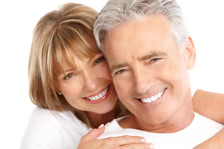 Couple with dentures smiling